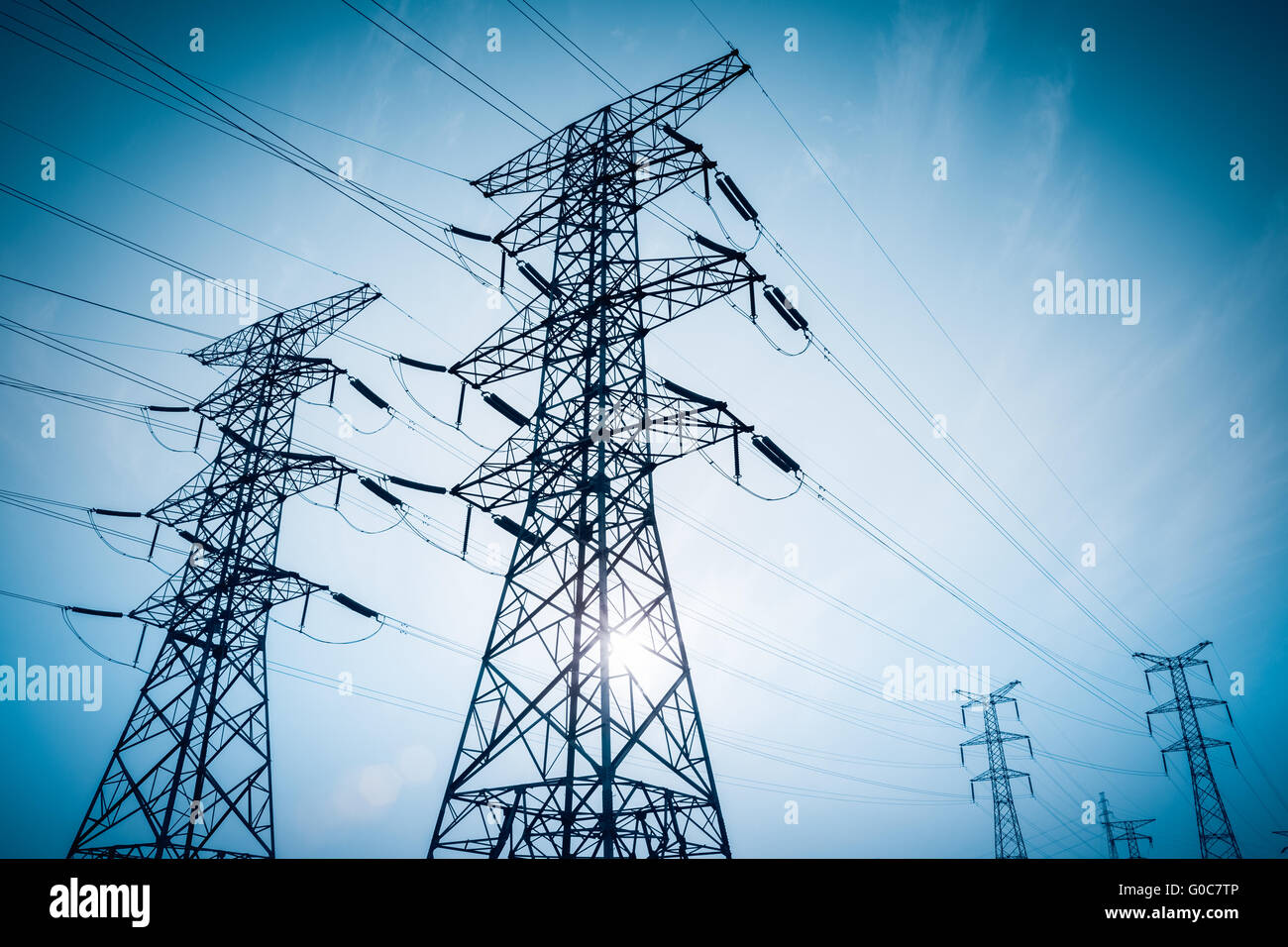 high voltage electricity transmission pylon silhouetted Stock Photo - Alamy