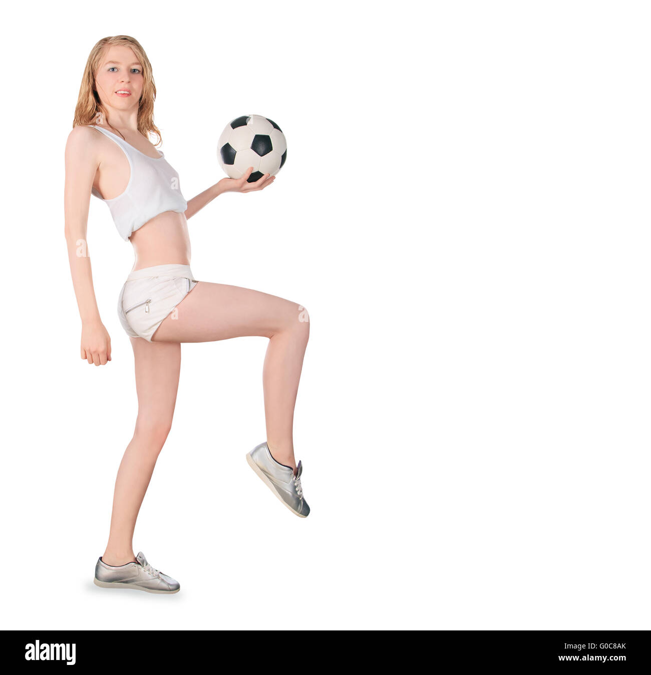 Young caucasian female with soccer ball on white background Stock Photo