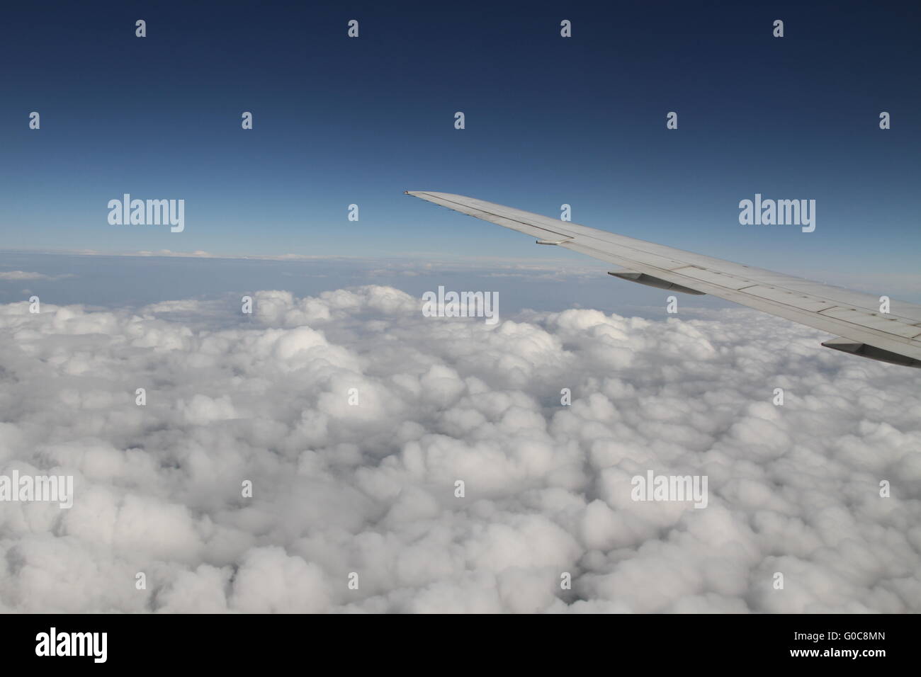 wing airplane above clouds view Stock Photo - Alamy