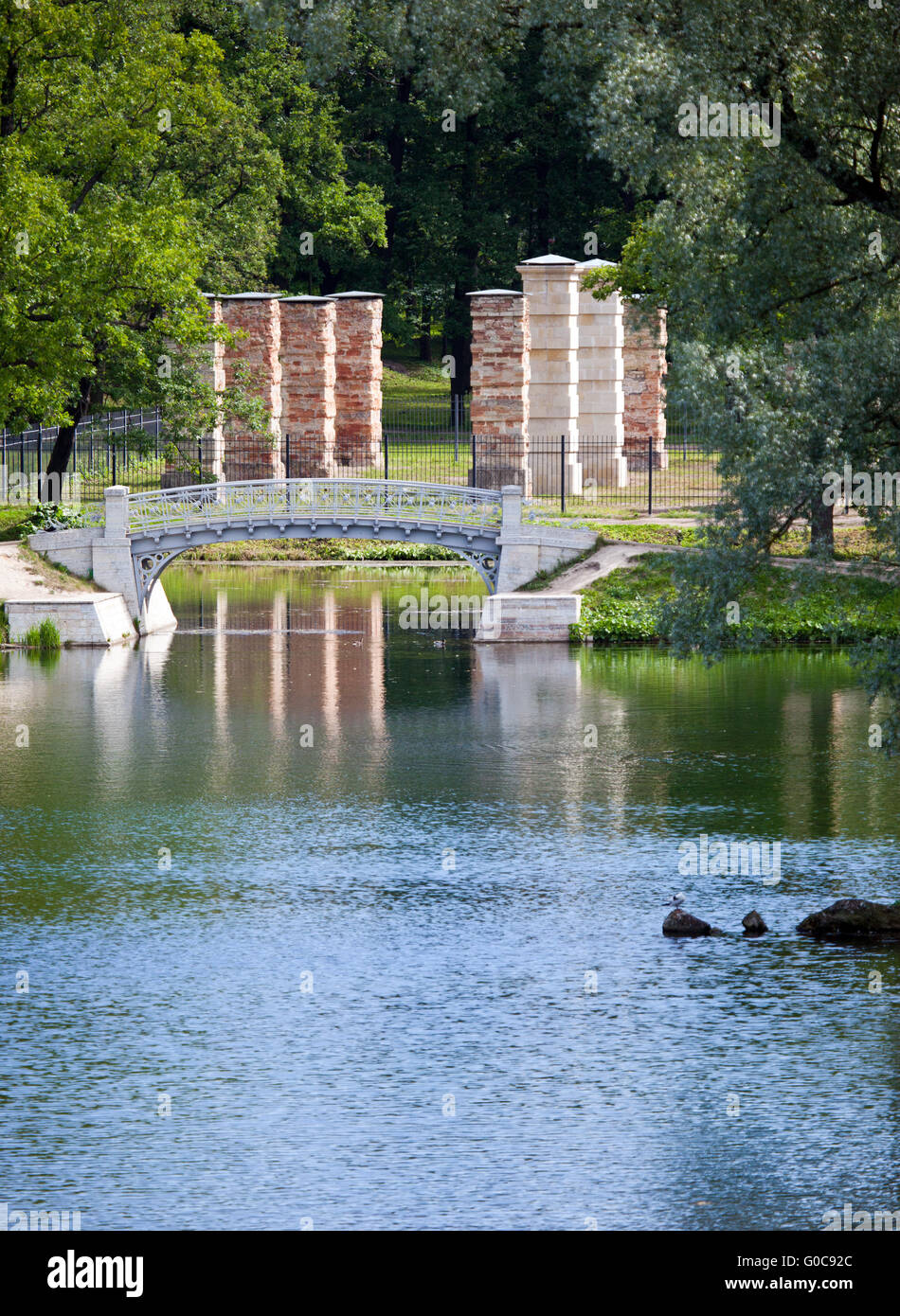 small shabby bridge in park over a pond. Gatchina. Stock Photo