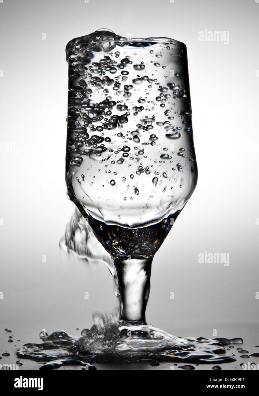 Water is being poured into a glass Stock Photo