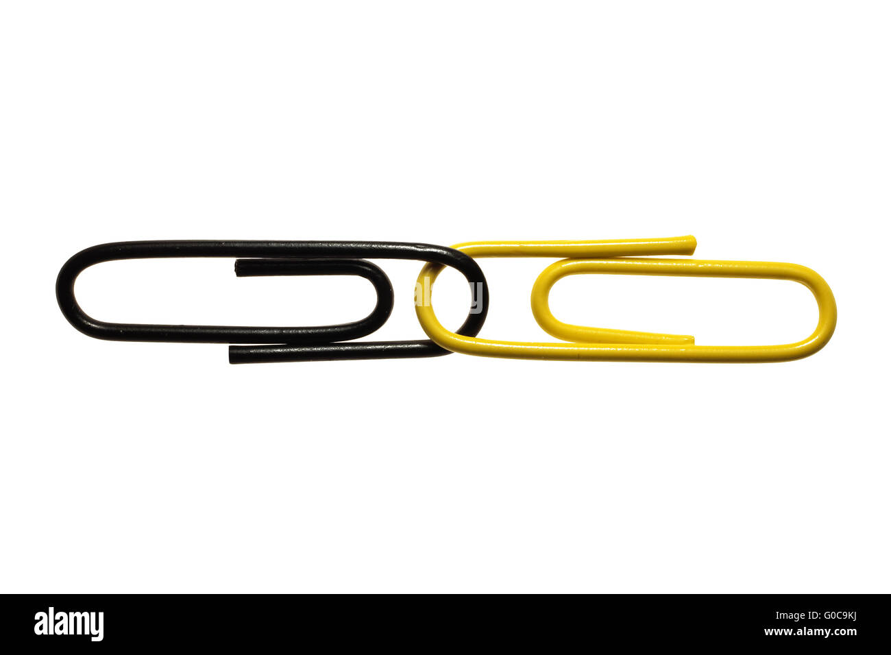 Black and yellow paper clips, symbolic image Stock Photo Alamy