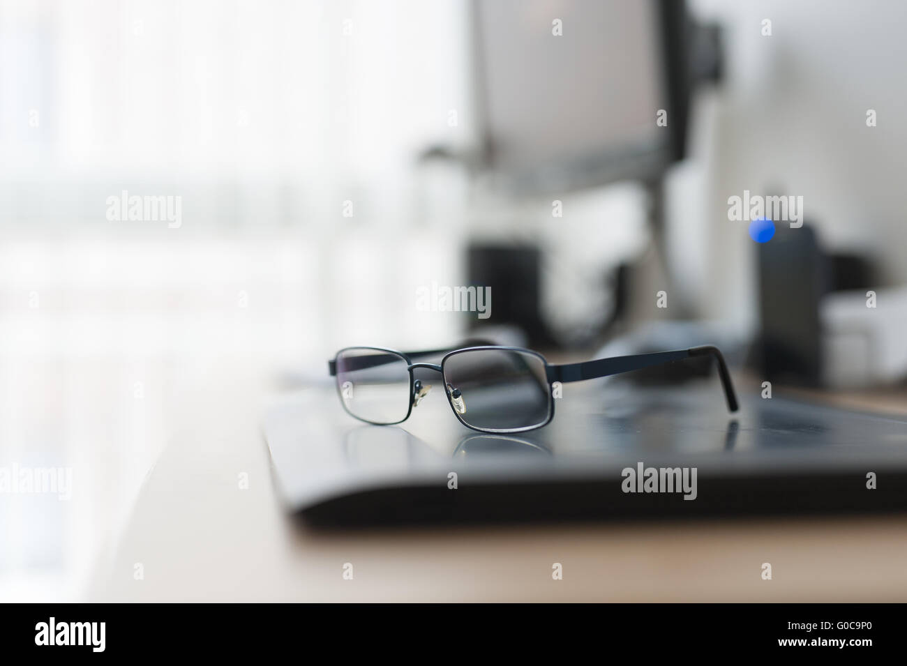 Work desk with PC and glasses Stock Photo Alamy