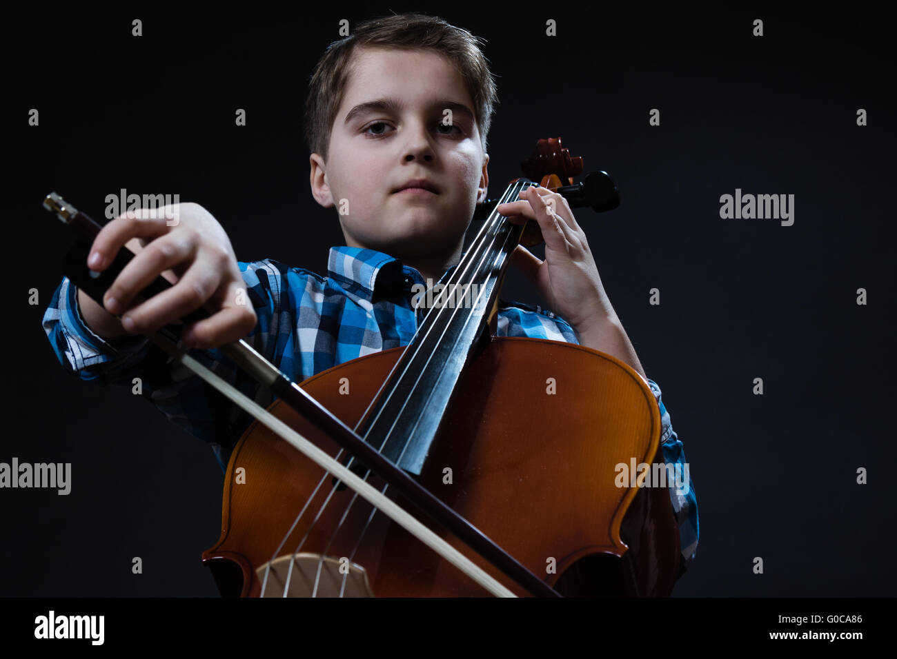 young Cellist playing classical music on cello Stock Photo Alamy