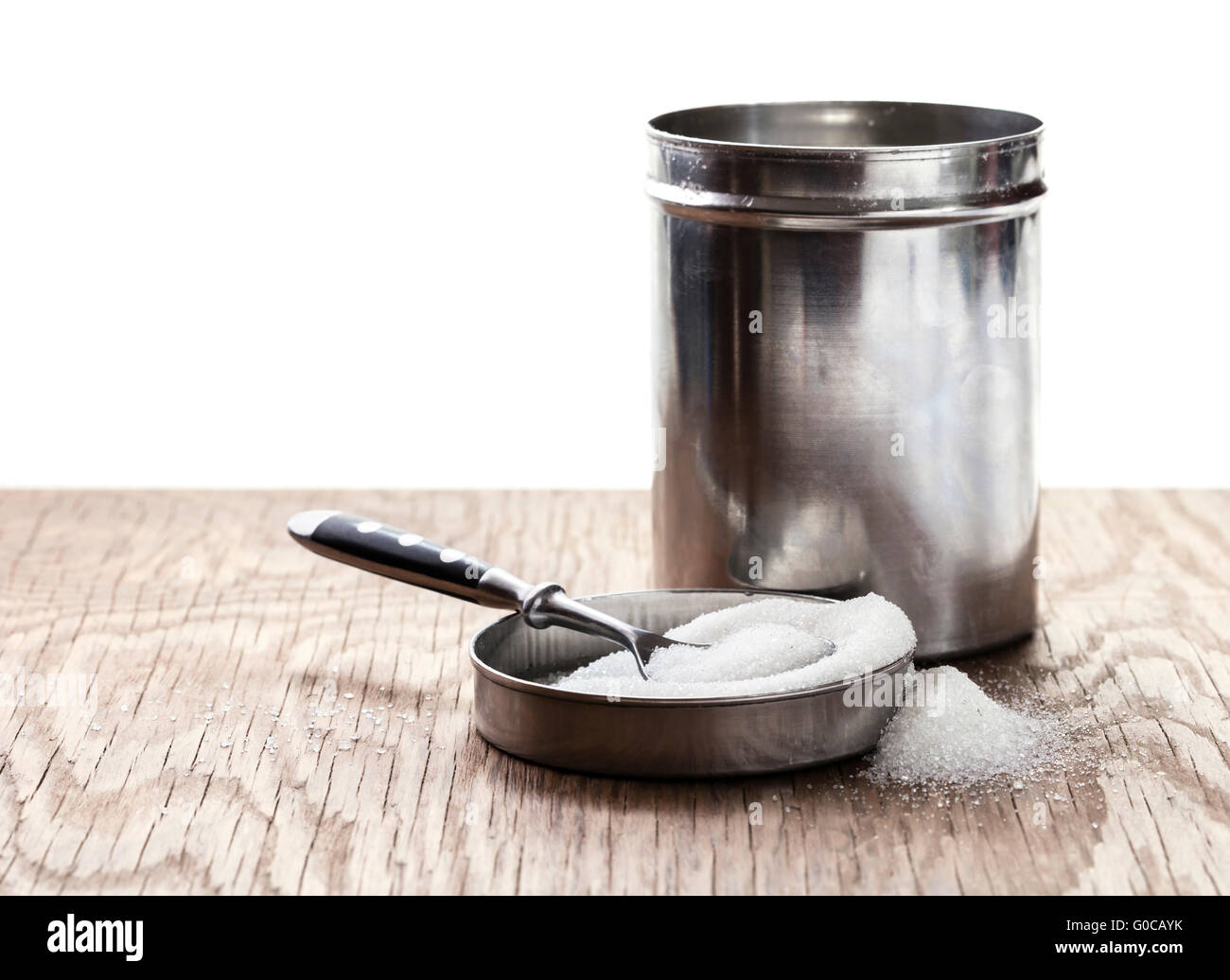 sugar bowl and spoon on a wooden background Stock Photo