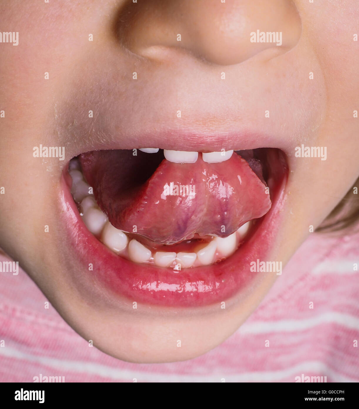 Little girl protruding tongue Stock Photo Alamy