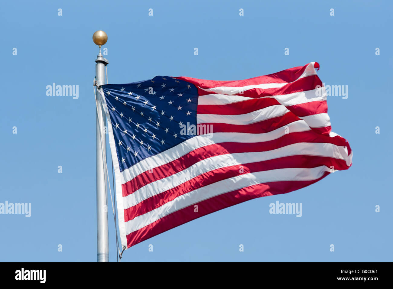 American flag on the blue sky Stock Photo - Alamy