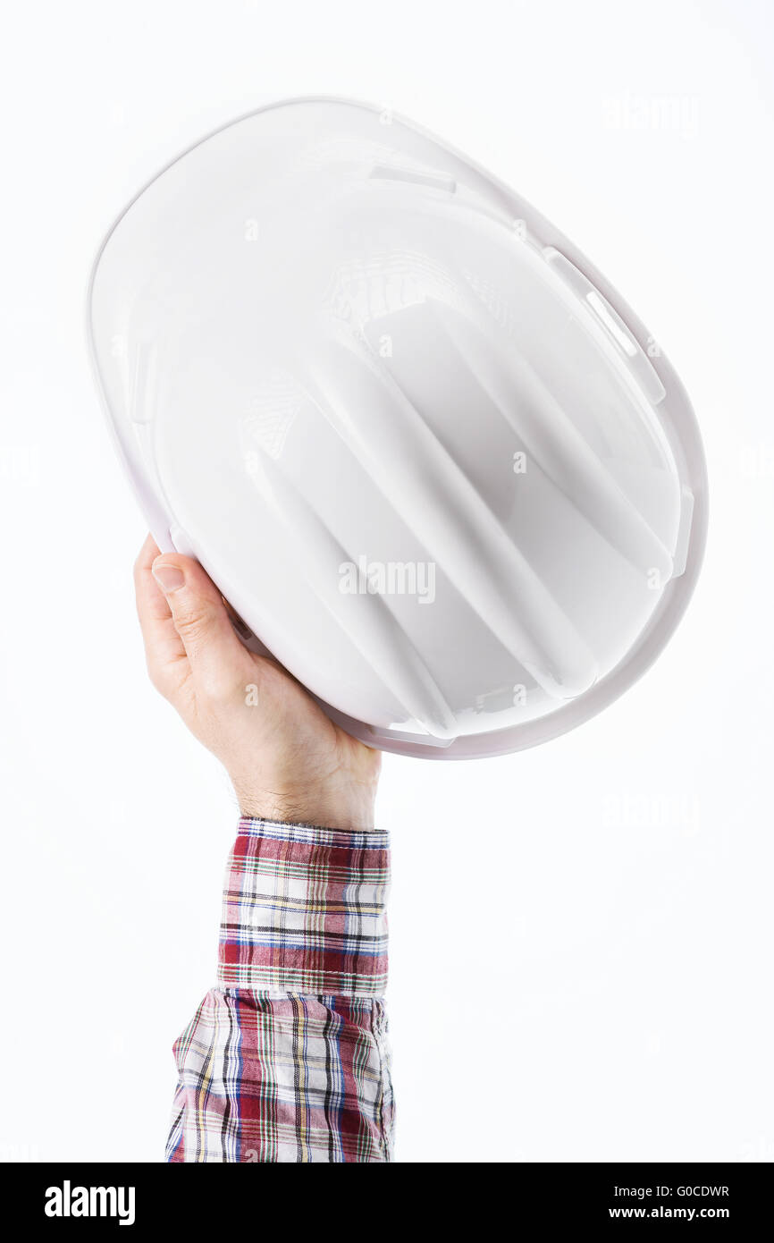 Builder male hand holding a safety helmet, safety at work concept Stock Photo