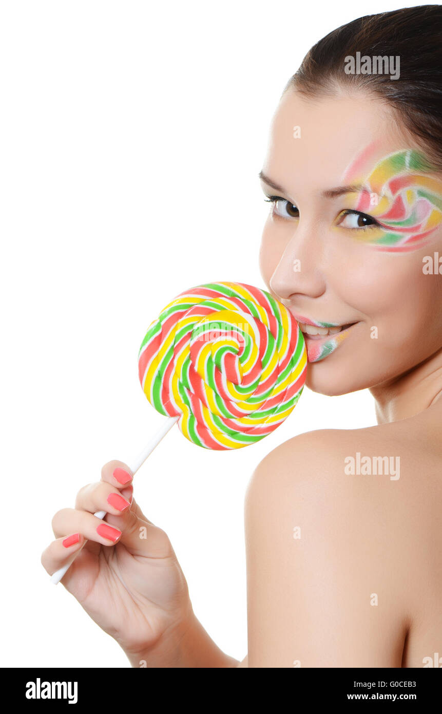 The girl with a sugar candy isolated on white Stock Photo - Alamy