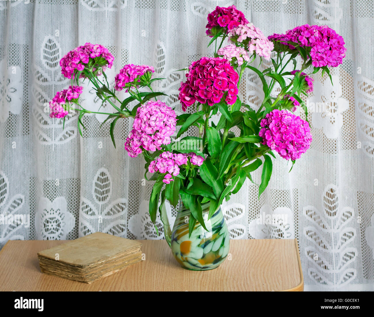 A bouquet of flowers carnations on the table in a Stock Photo