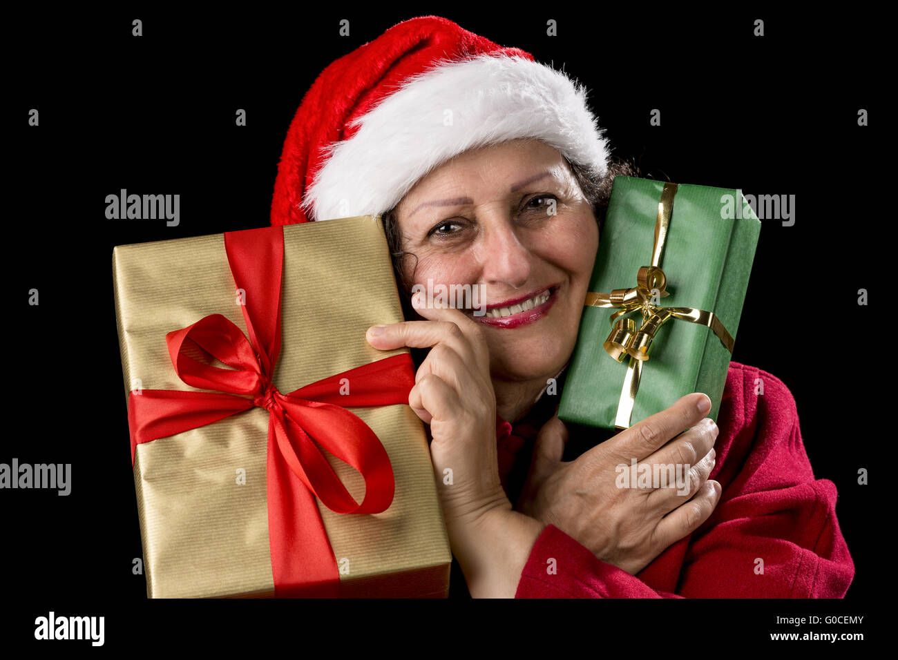 Old Woman in Red with Two Wrapped Christmas Gifts Stock Photo