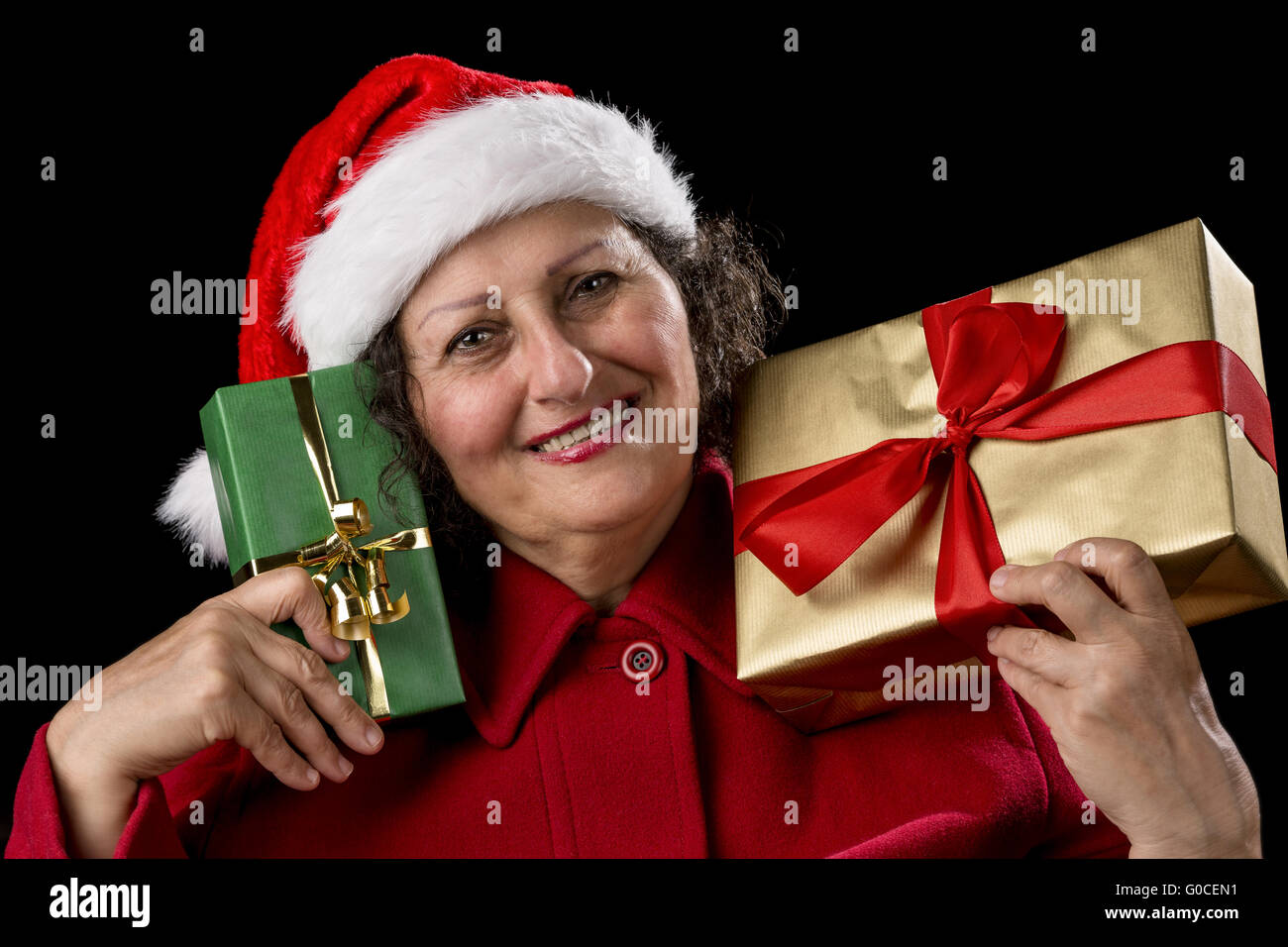 Smiling Lady with Golden and Green Christmas Gifts Stock Photo