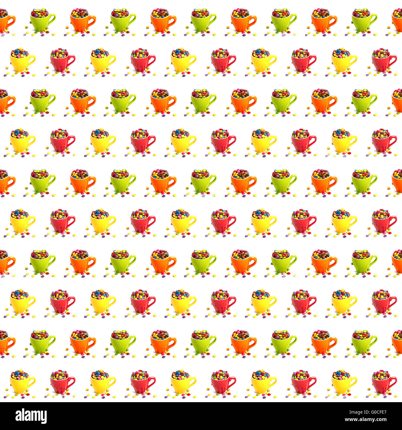 Pattern of colorful dragees in small colored cups Stock Photo