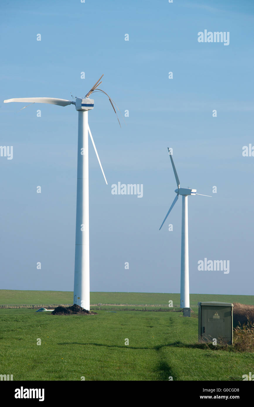 destroyed and running wind turbine Stock Photo