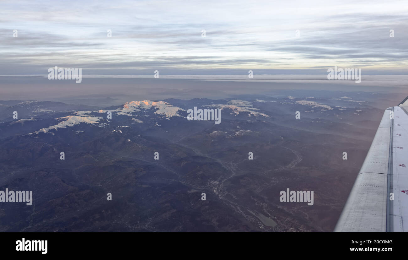 Aerial view of snow covered mountains Stock Photo - Alamy