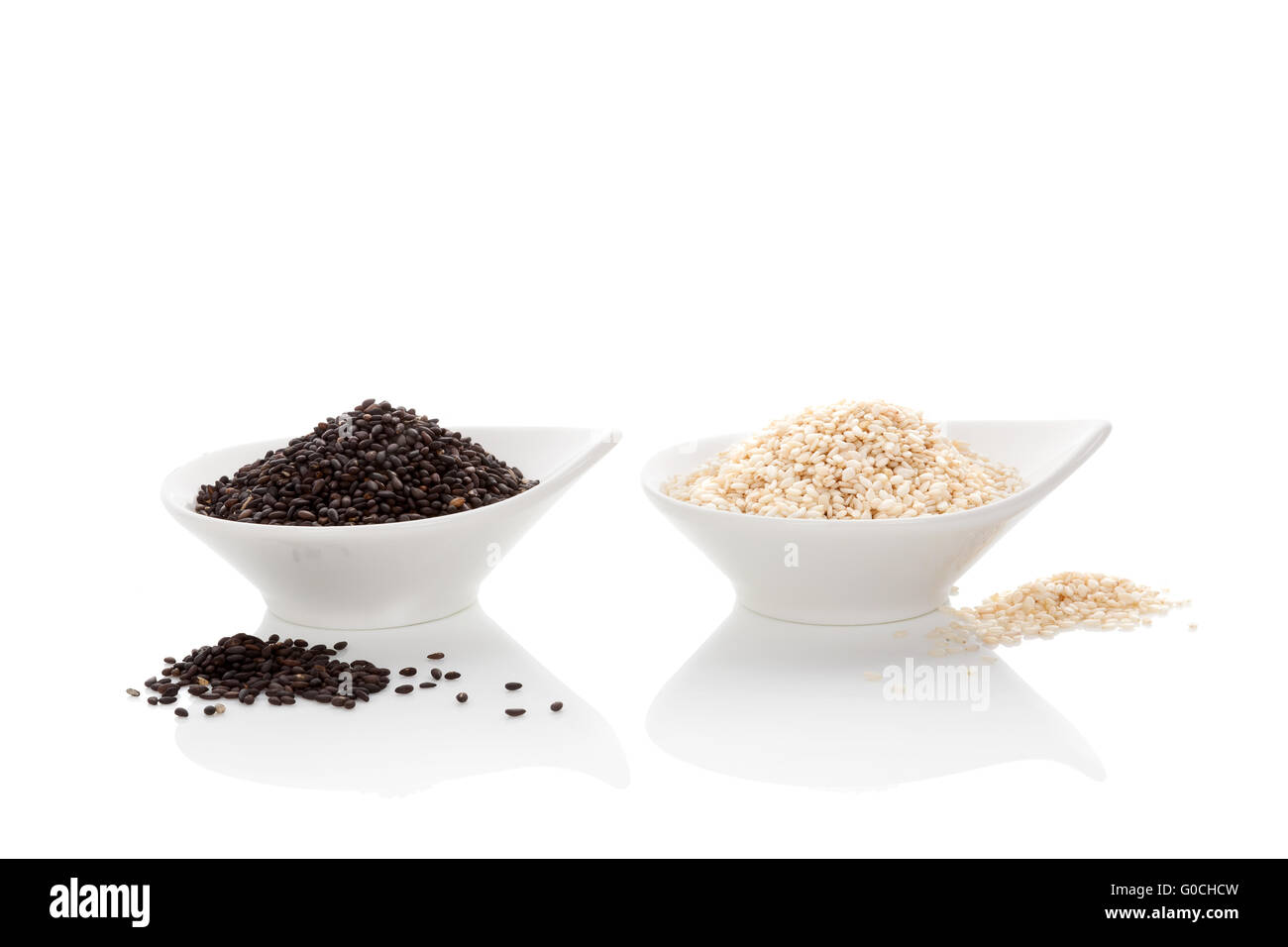 Black and white sesame seeds isolated on white Stock Photo - Alamy