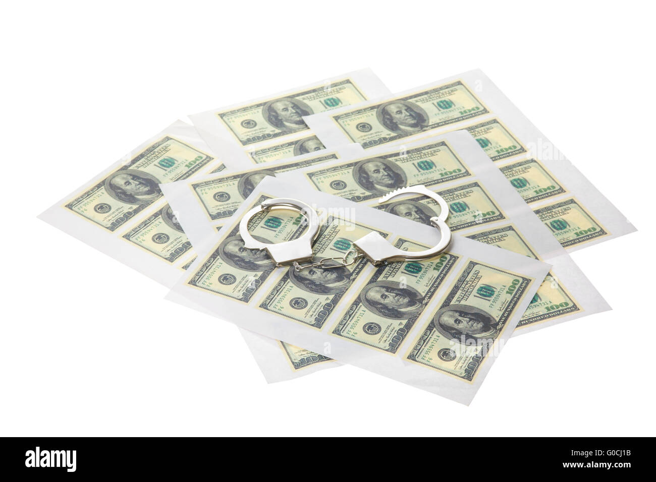 Printed sheets with dollars and handcuffs. Stock Photo