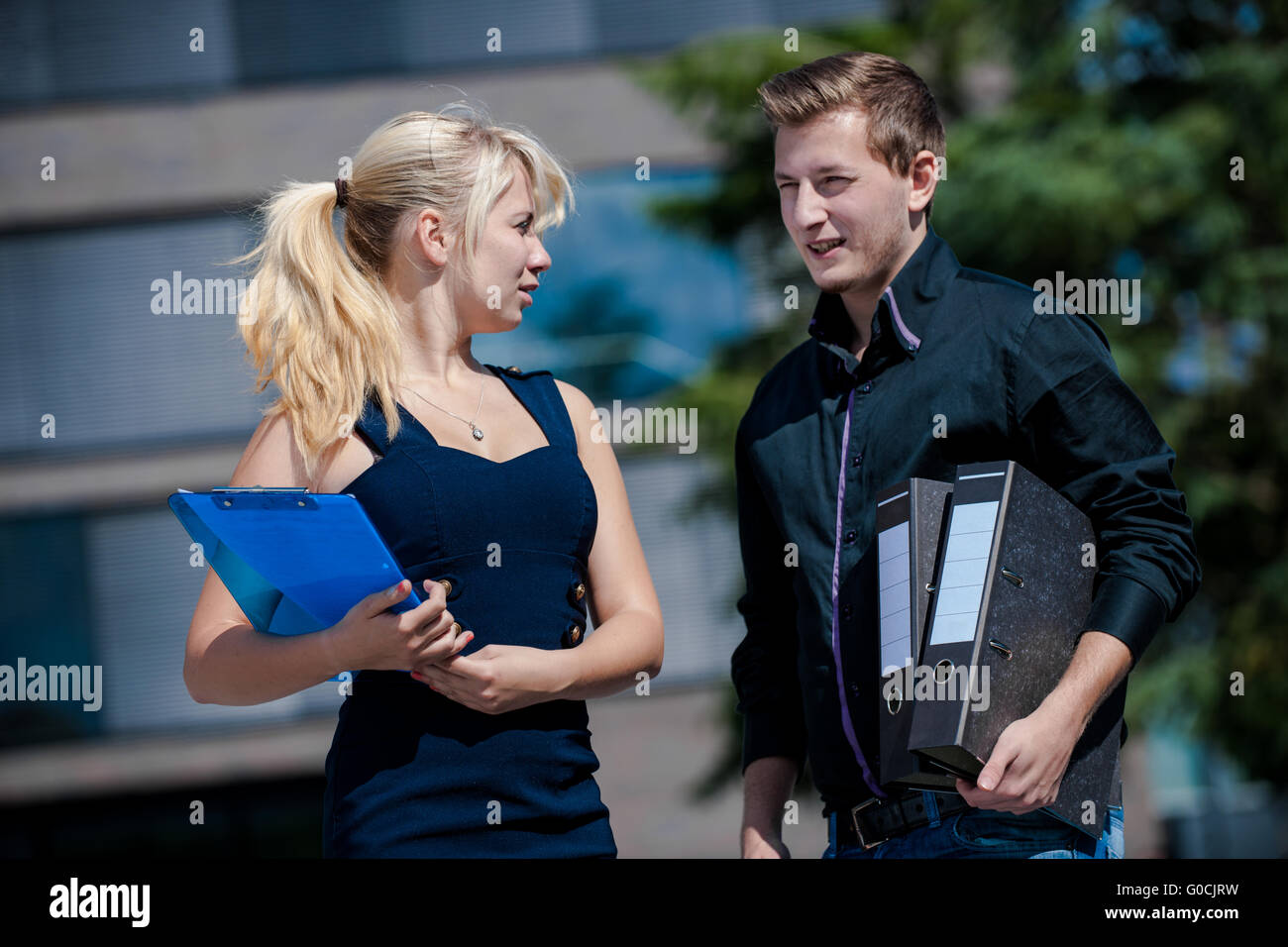 Two businessmen talking about important documents Stock Photo