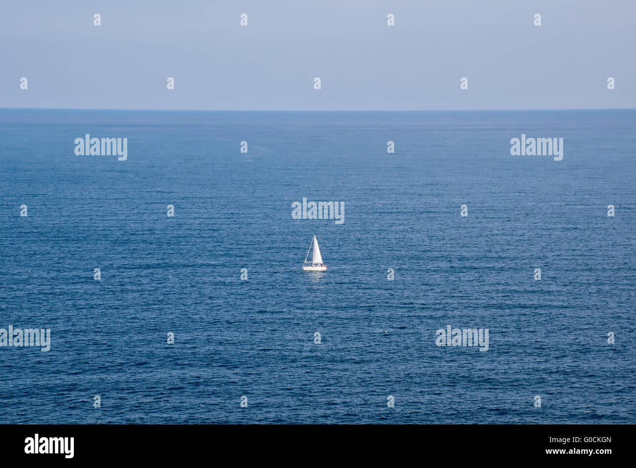 A sailing boat in the blue sea Stock Photo - Alamy