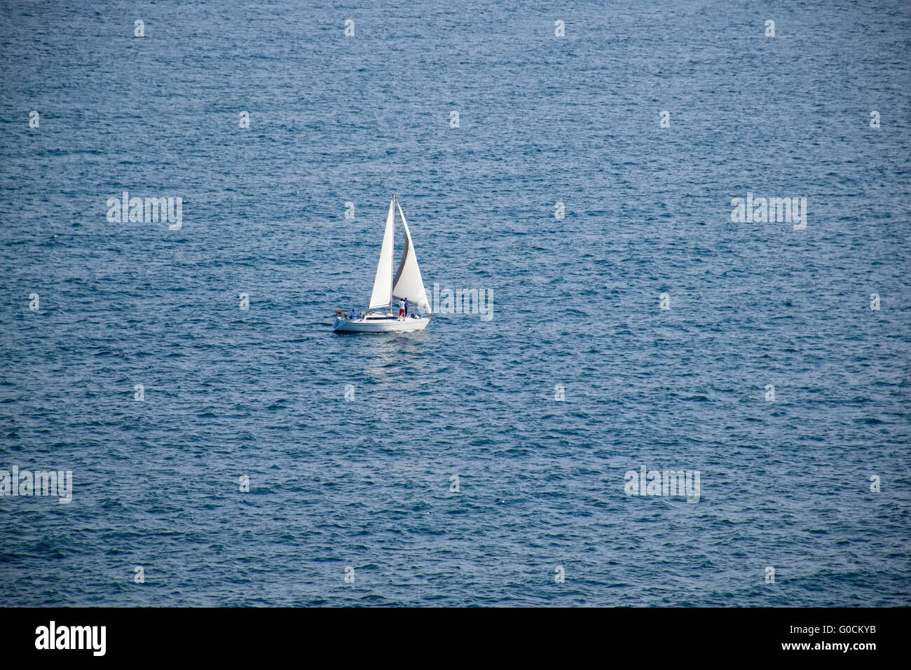A sailing boat in the blue sea Stock Photo - Alamy