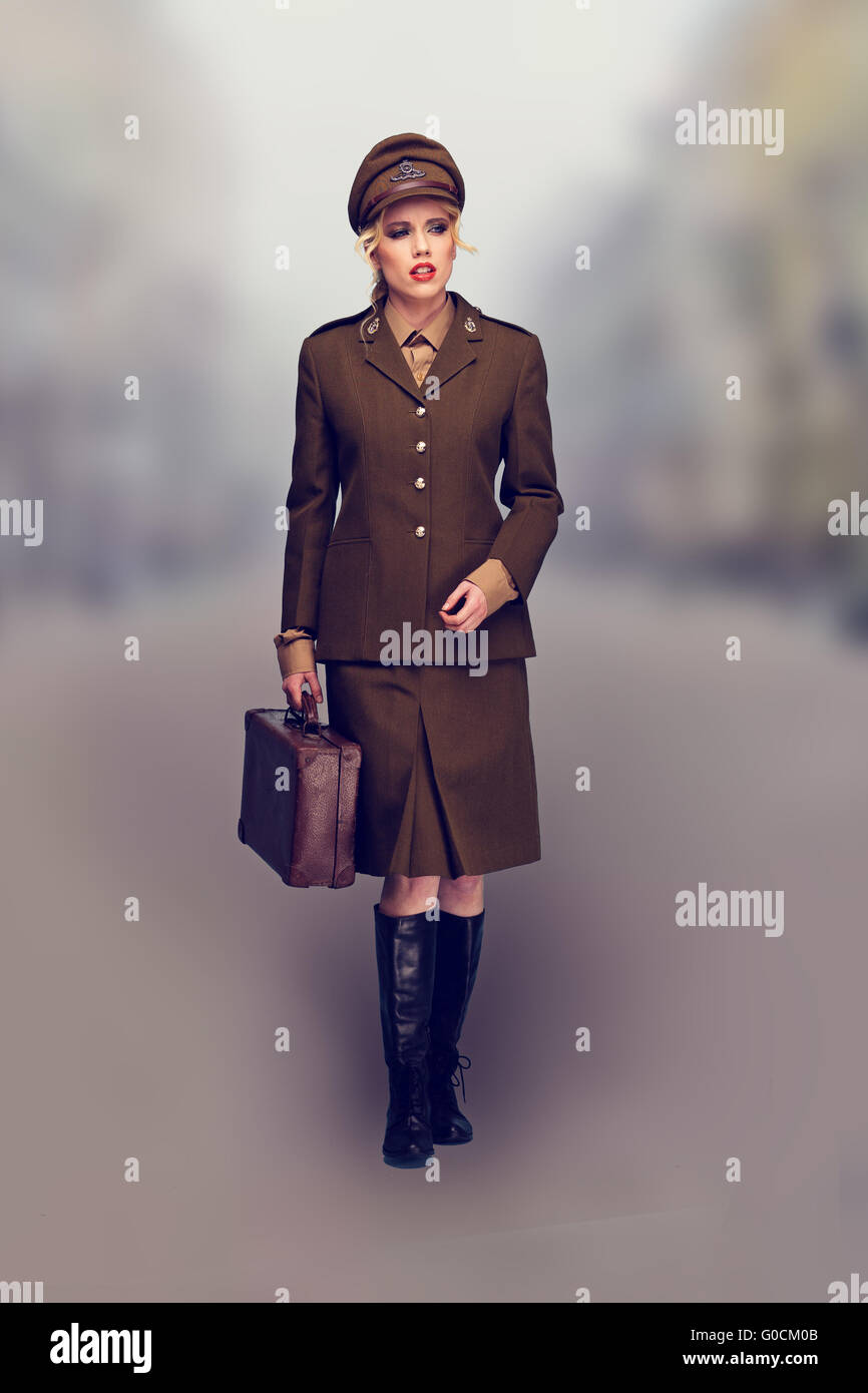 Elegant woman in a brown army uniform Stock Photo