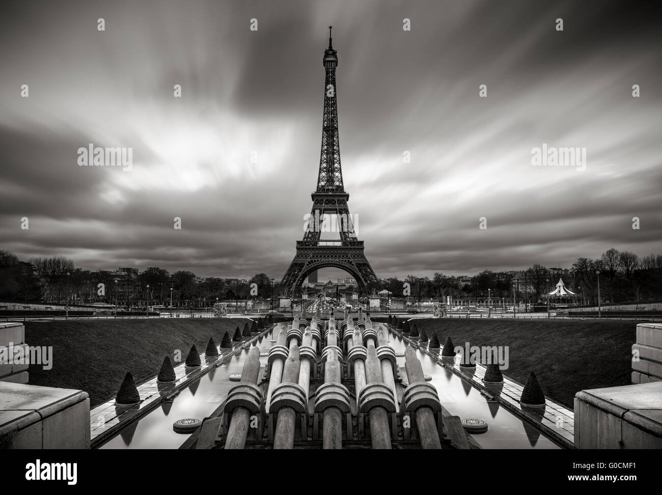 Eiffel Tower and Trocadero at sunrise with fast moving clouds, Paris, France. Black & White. Stock Photo