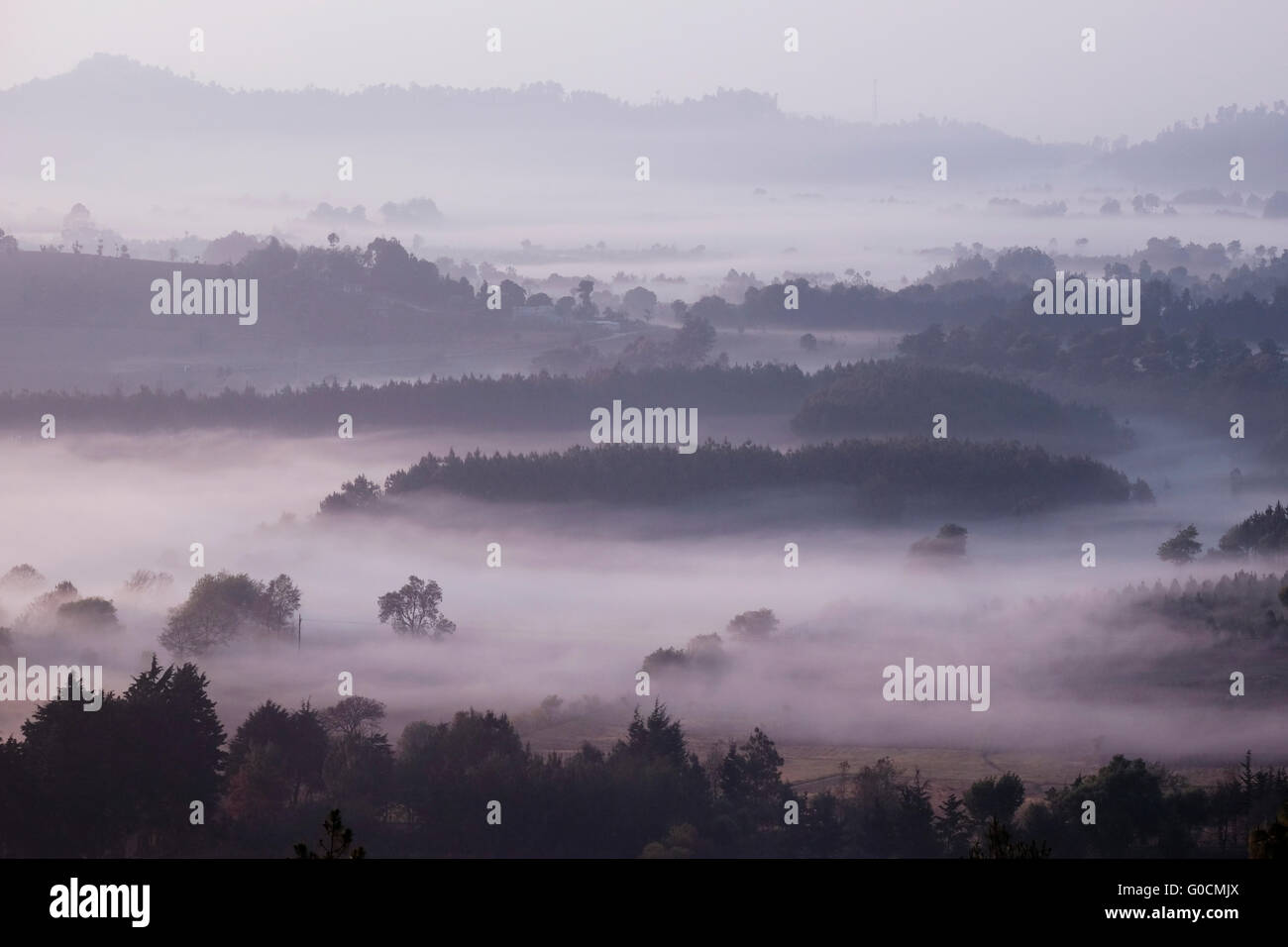 Early morning fog covers the Tecpan valley a municipality in the department of Chimaltenango on the Inter-American Highway CA-1 Guatemala Central America Stock Photo