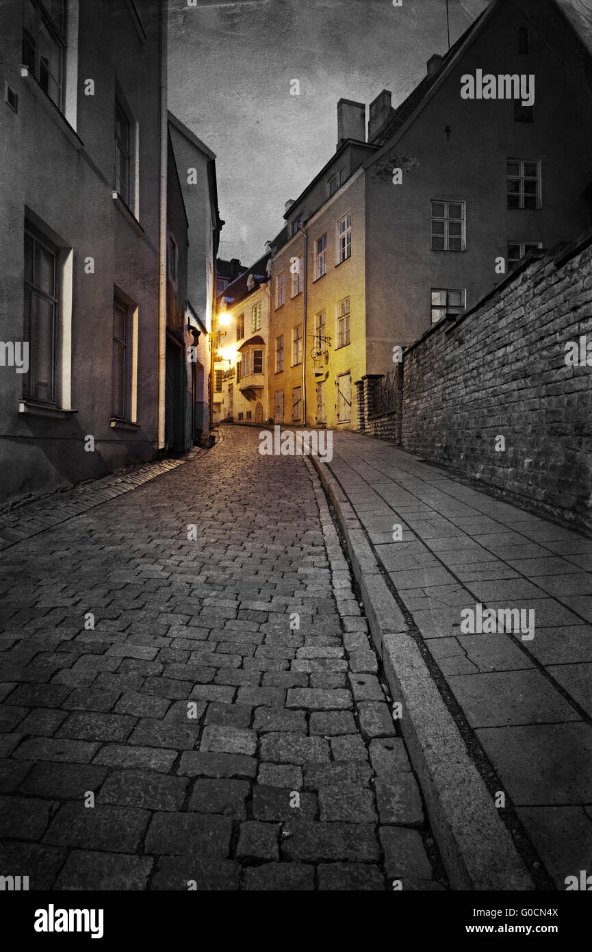 Vintage style photo of old European town street at night Stock Photo ...
