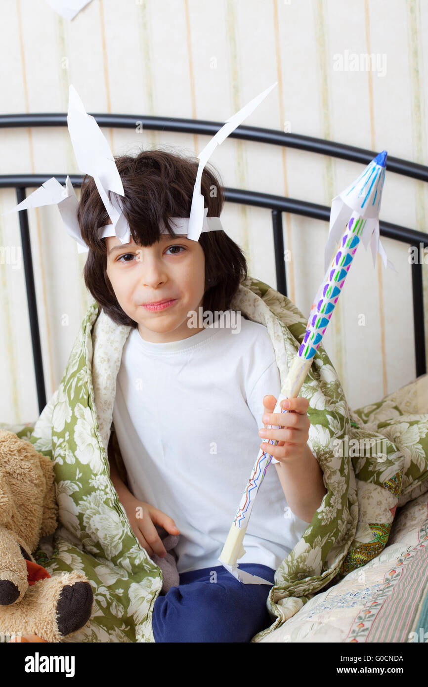 Cheerful boy in the image of the American Indian Stock Photo