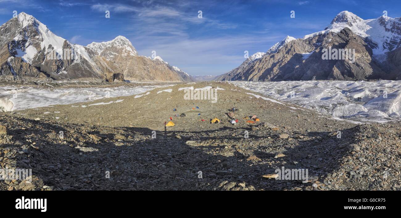 Scenic panorama of base camp on Engilchek glacier in picturesque Tian Shan mountain range in Kyrgyzstan Stock Photo