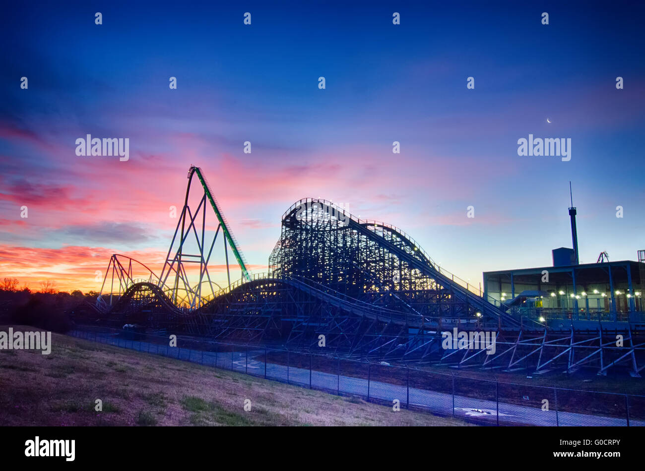 curves of a roller Coaster at Sunset or sunrise Stock Photo