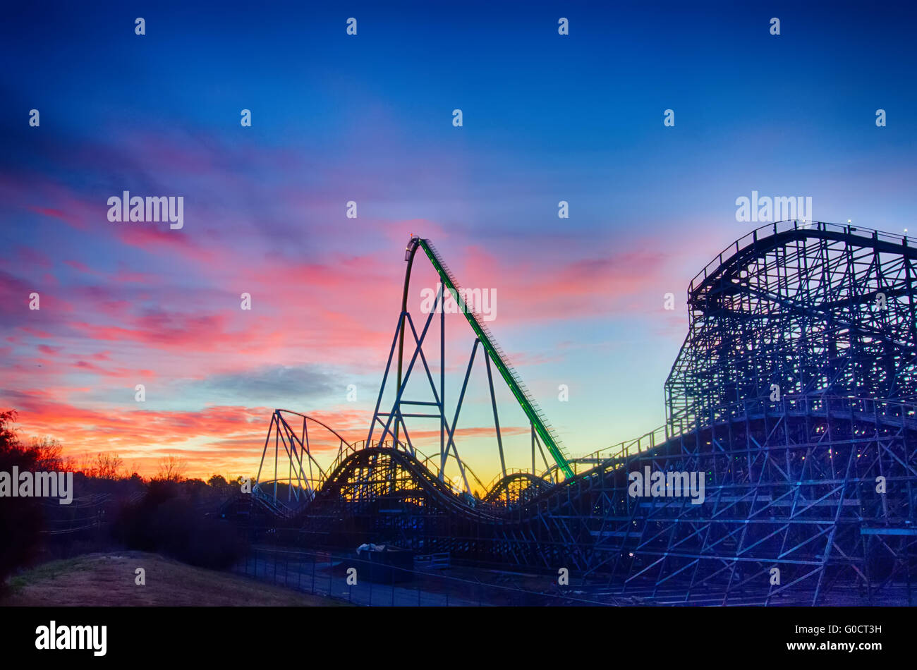 curves of a roller Coaster at Sunset or sunrise Stock Photo