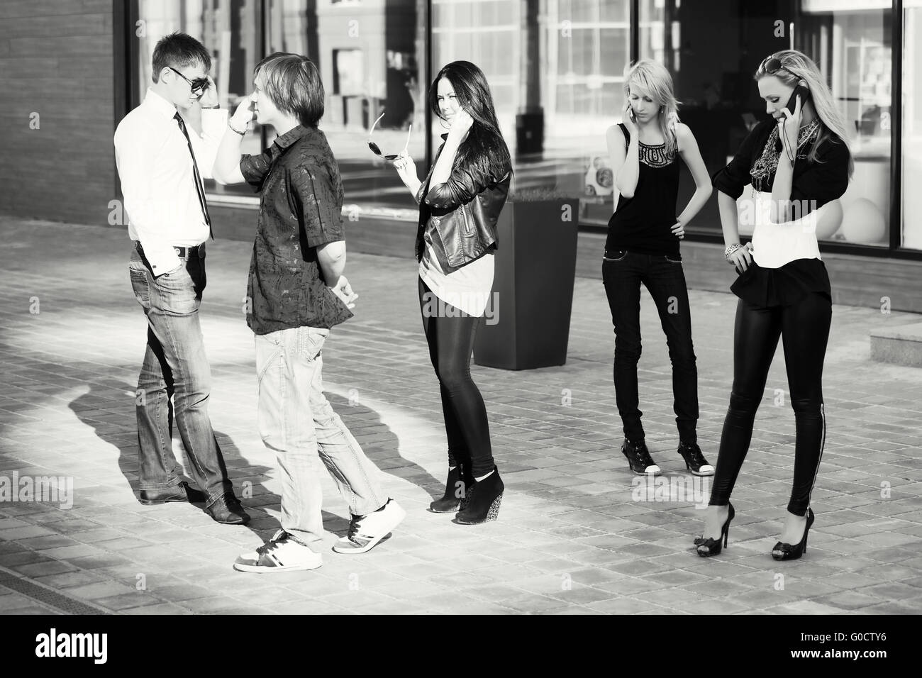 Group of young people calling on the cell phones Stock Photo