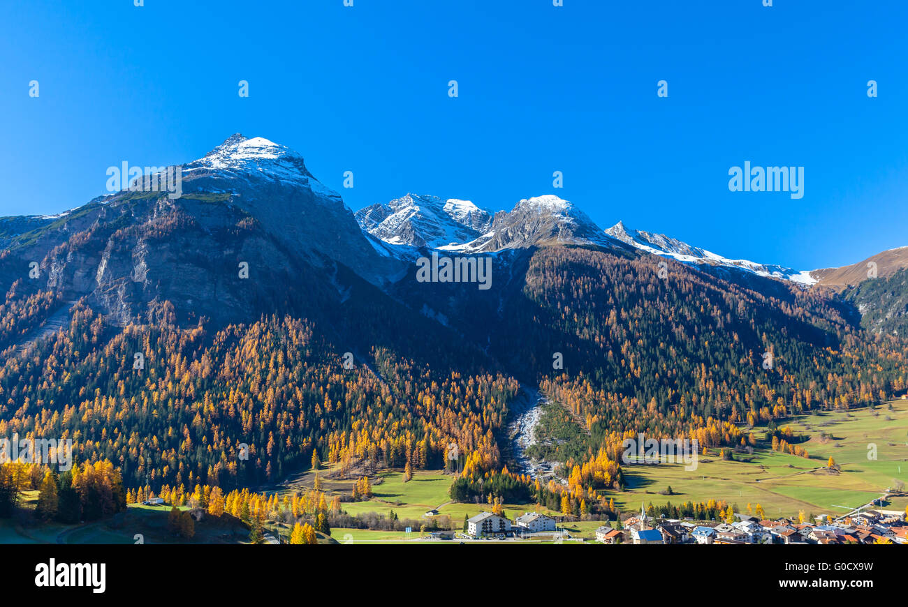 Beautiful view of the small town Bergun and the alps including Piz Ela from the sightseeing train Bernina Express in golden autu Stock Photo