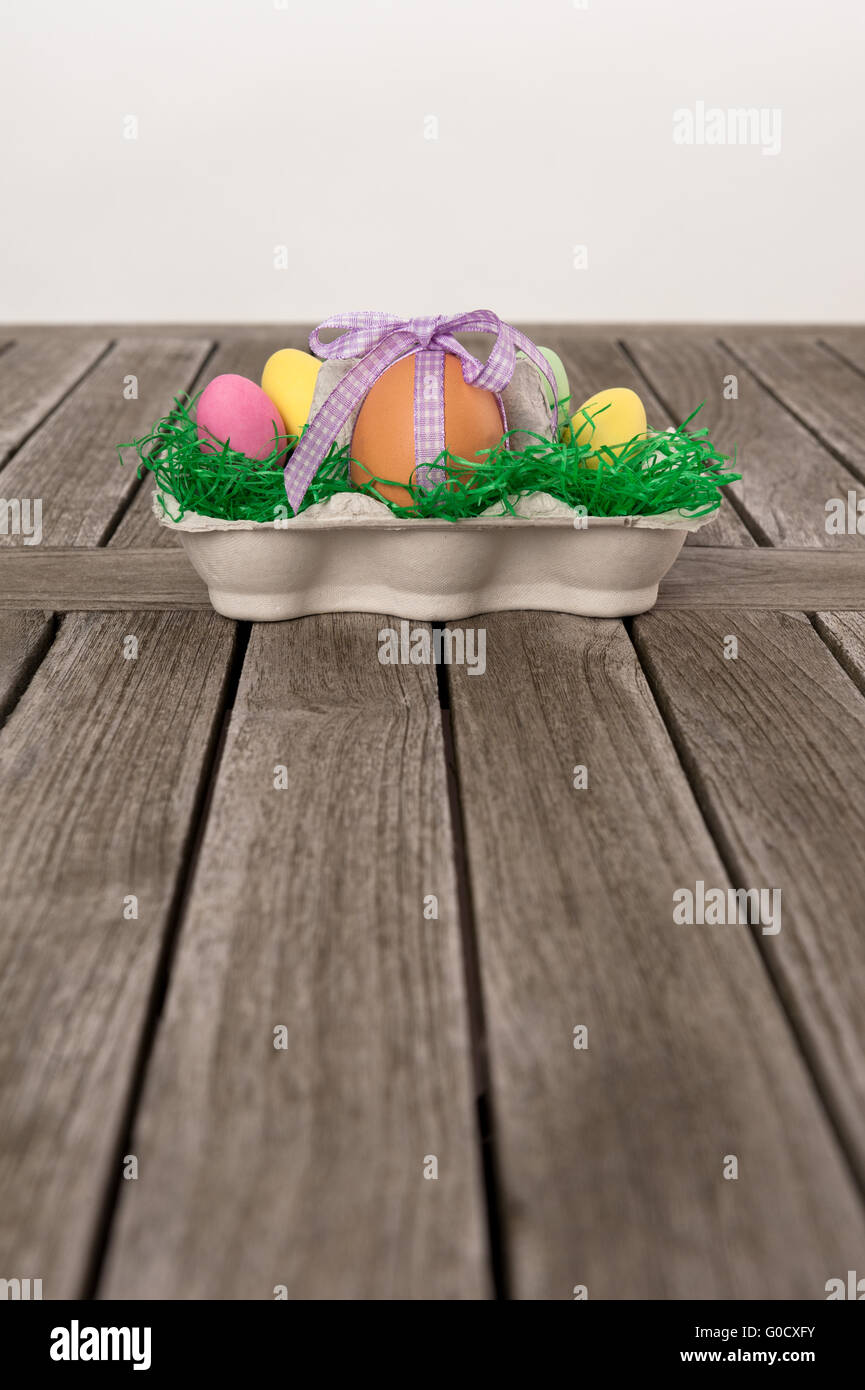 Easter Nest with eggs on a wooden table. Stock Photo