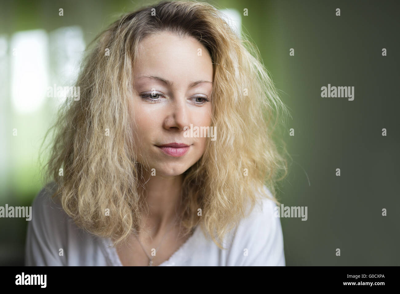 Portrait of a thoughtful young woman with no makeu Stock Photo
