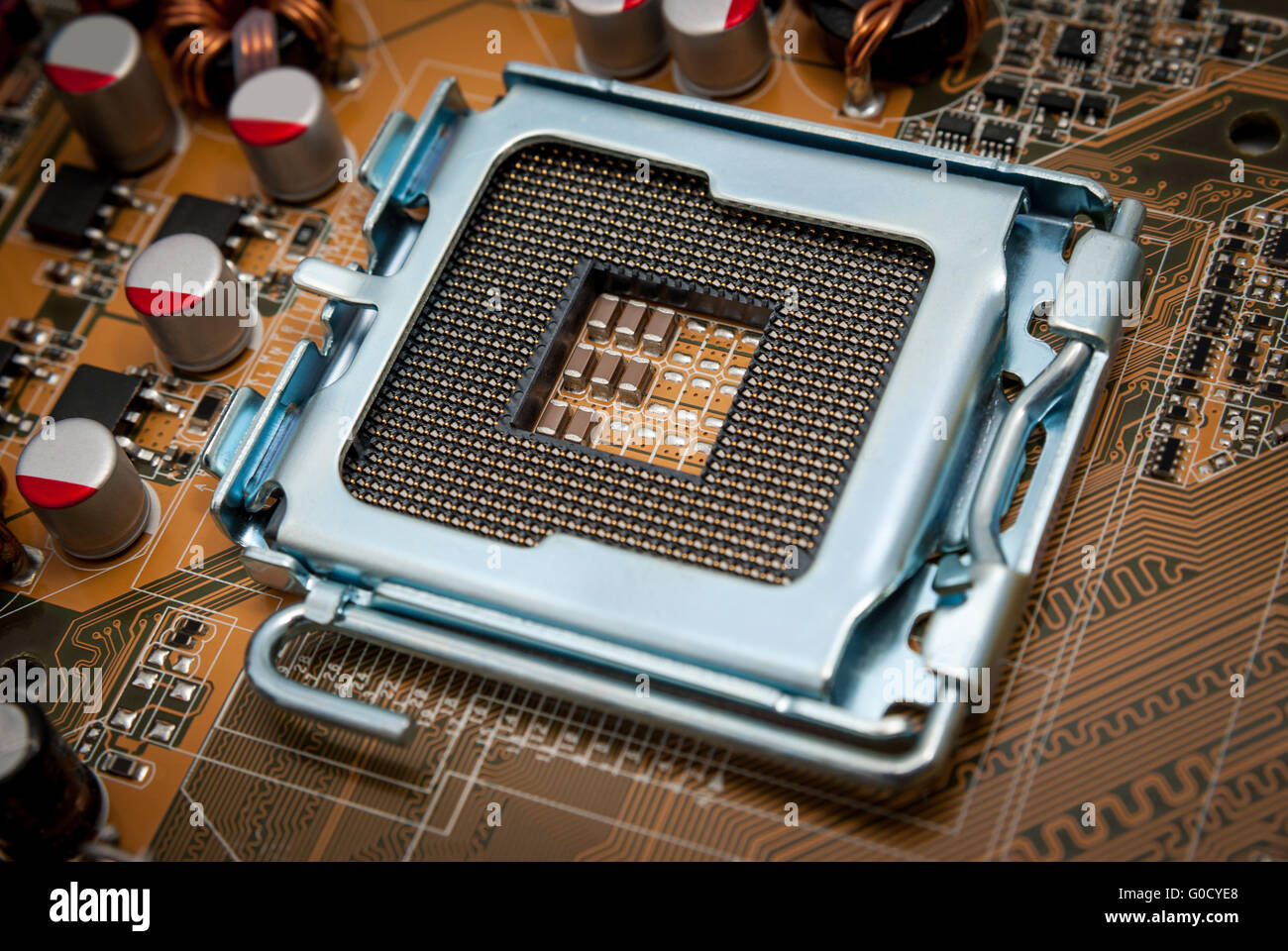 Empty CPU processor socket with pins on motherboar Stock Photo
