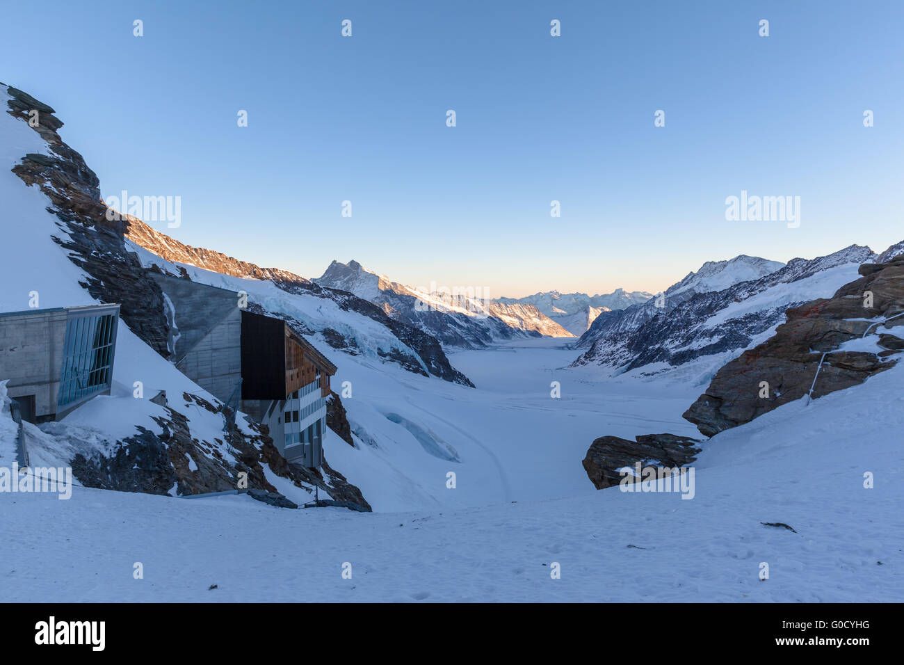 Panorama view of Aletsch glacier from the view platform on Jungfraujoch at twilight in winter, the highest railway station of Eu Stock Photo