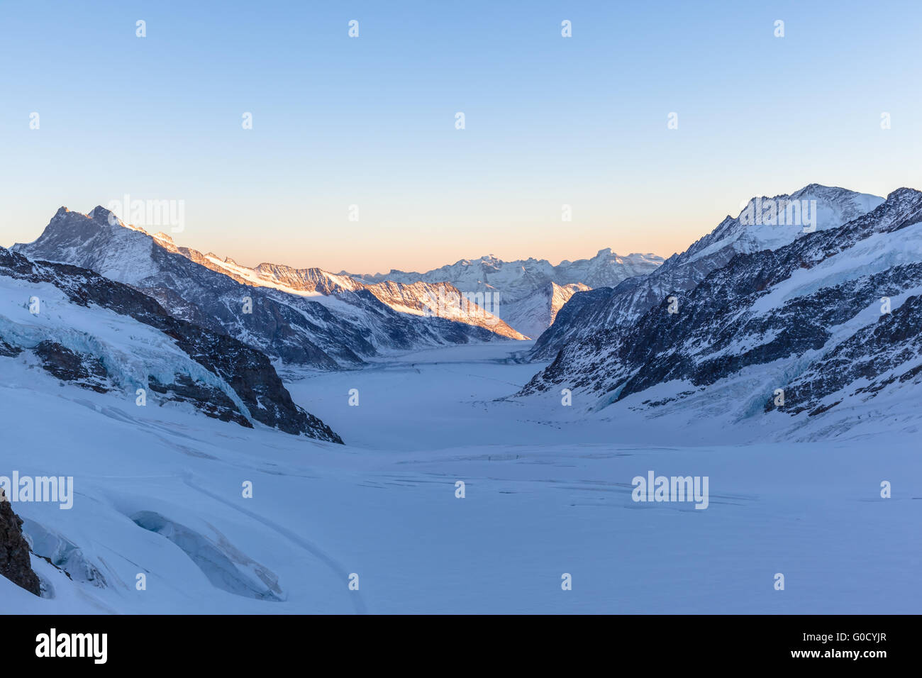 Stunning view of Aletsch glacier from the view platform on Jungfraujoch at twilight in winter, the highest railway station of Eu Stock Photo