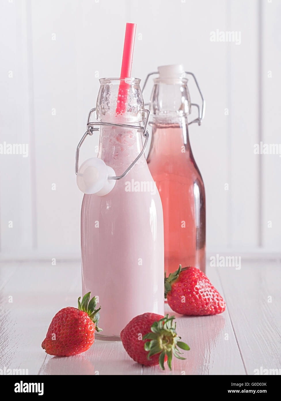 Strawberry milk and strawberry juice into bottles Stock Photo Alamy