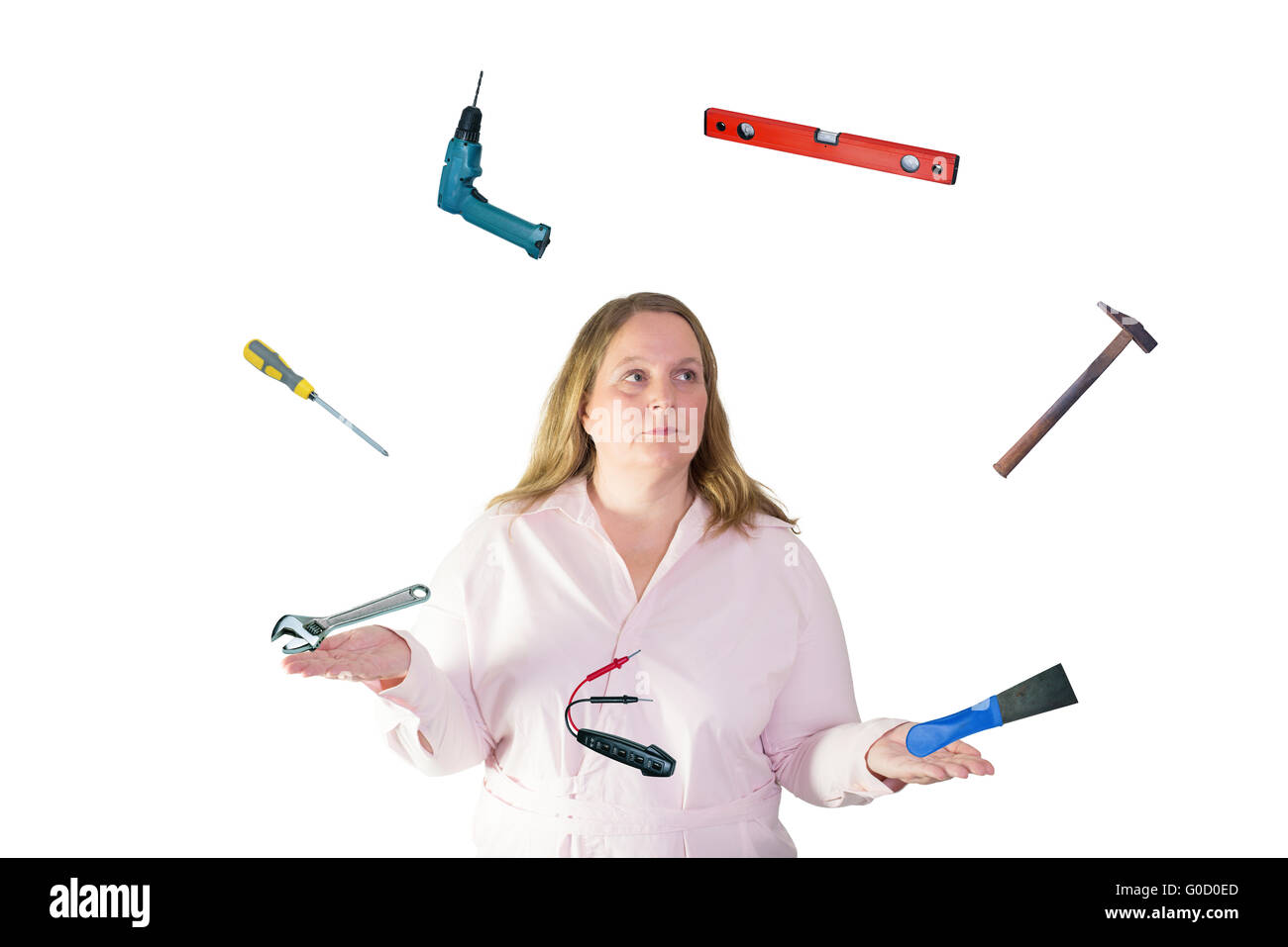 Woman juggles with tool Stock Photo
