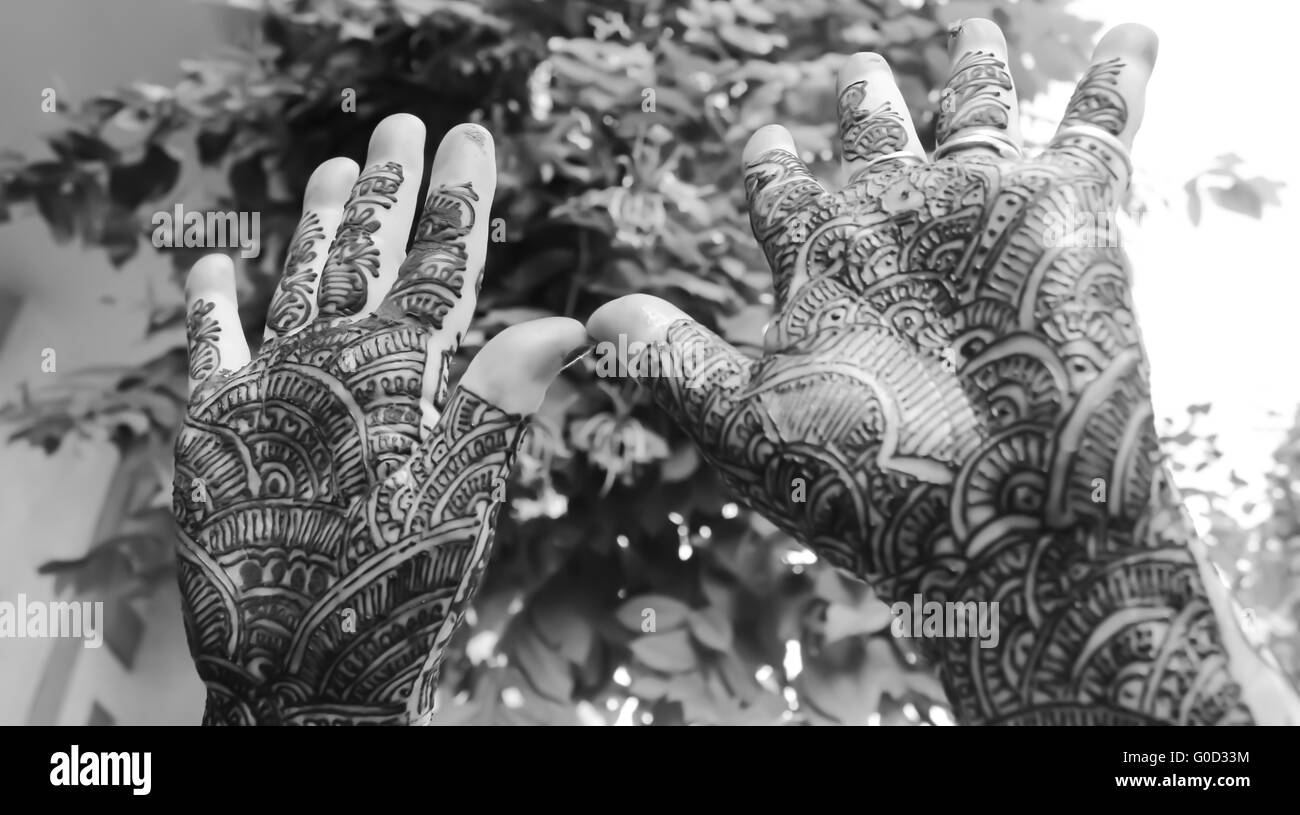 designing mehandi showing by hands up Stock Photo