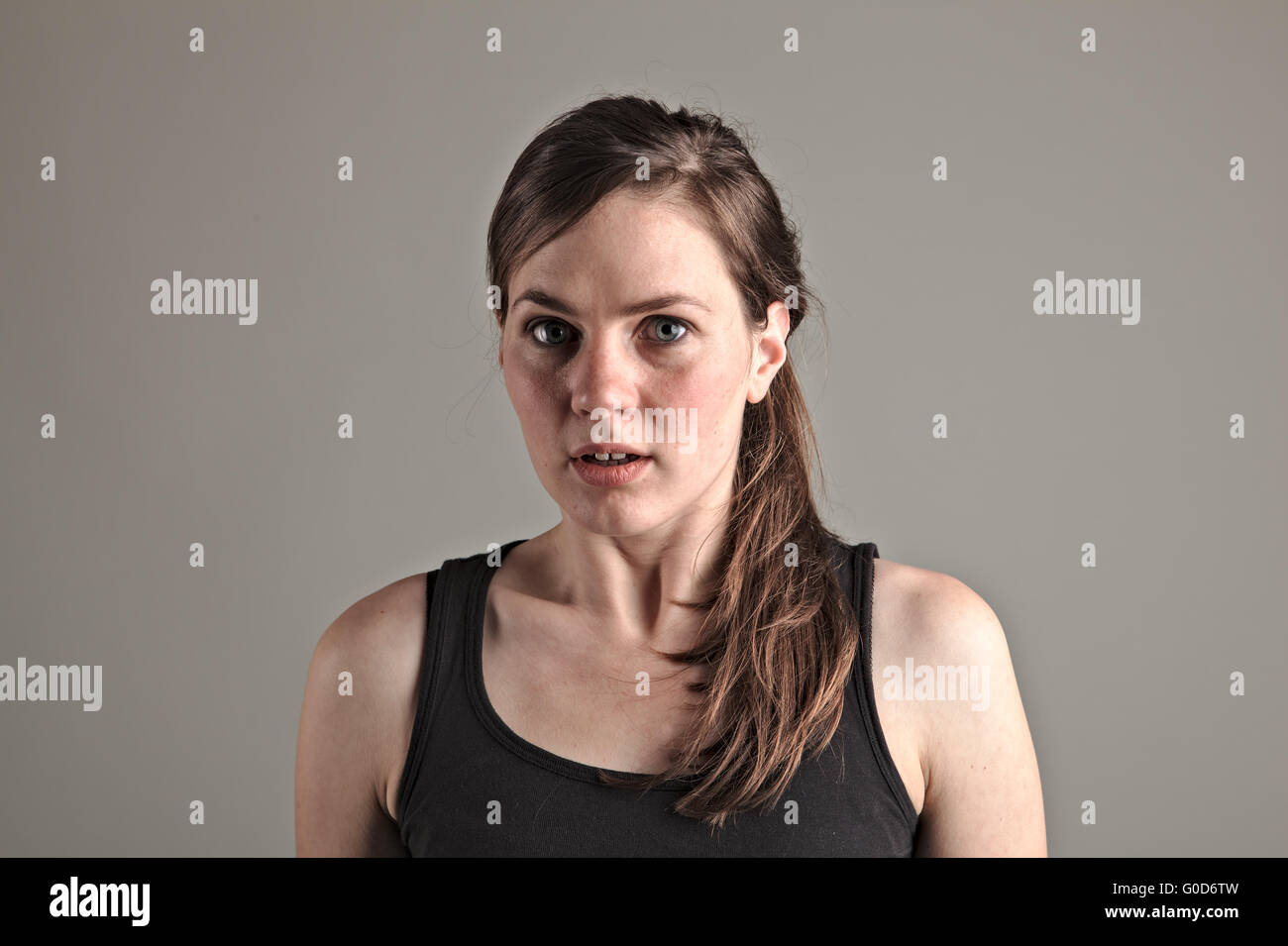 Young woman gets frightened Stock Photo