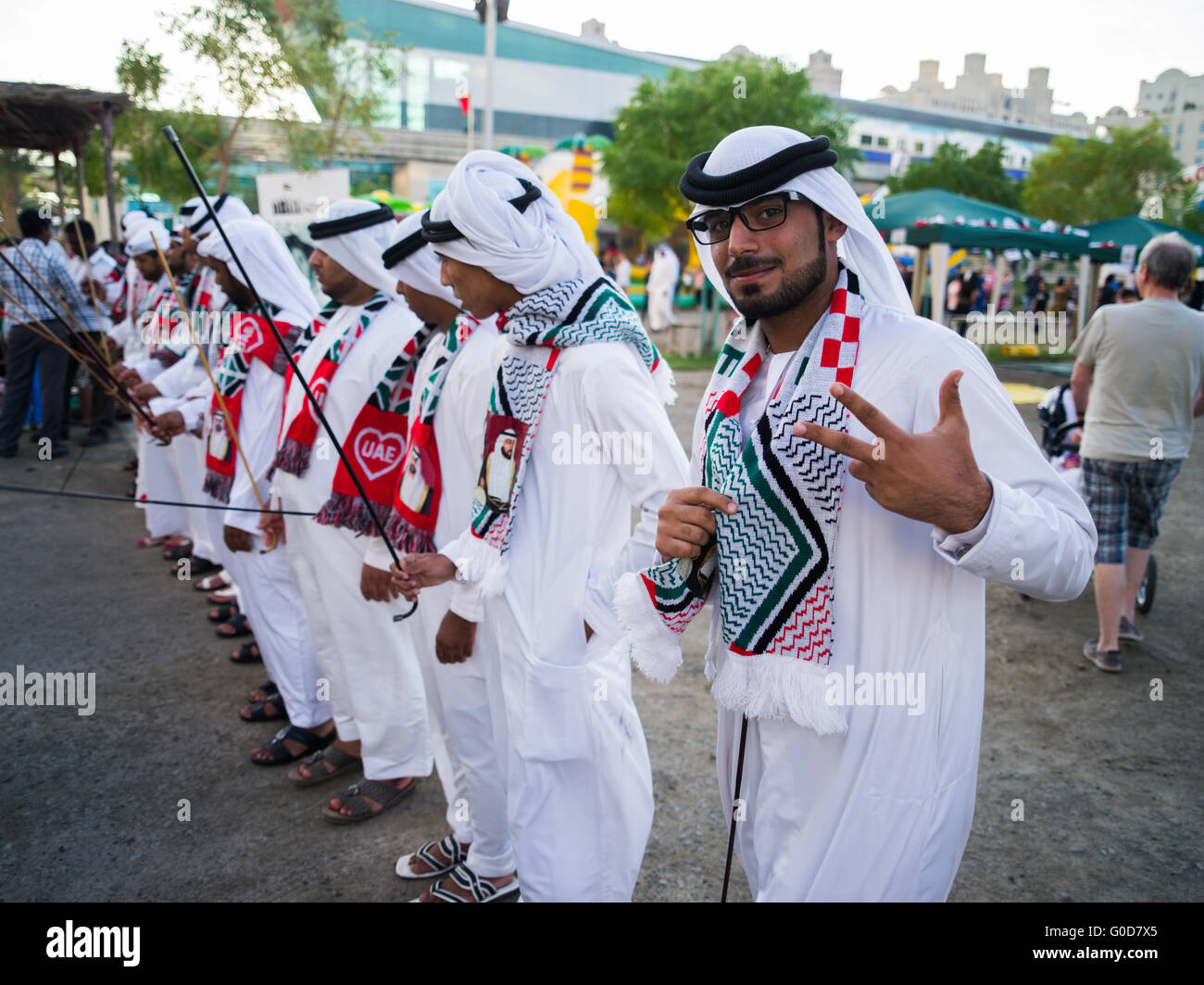 Dubai, - November 28, 2013: emirates men in traditional dress celebrate the 4th year of the foundation of the UAE state Stock Photo