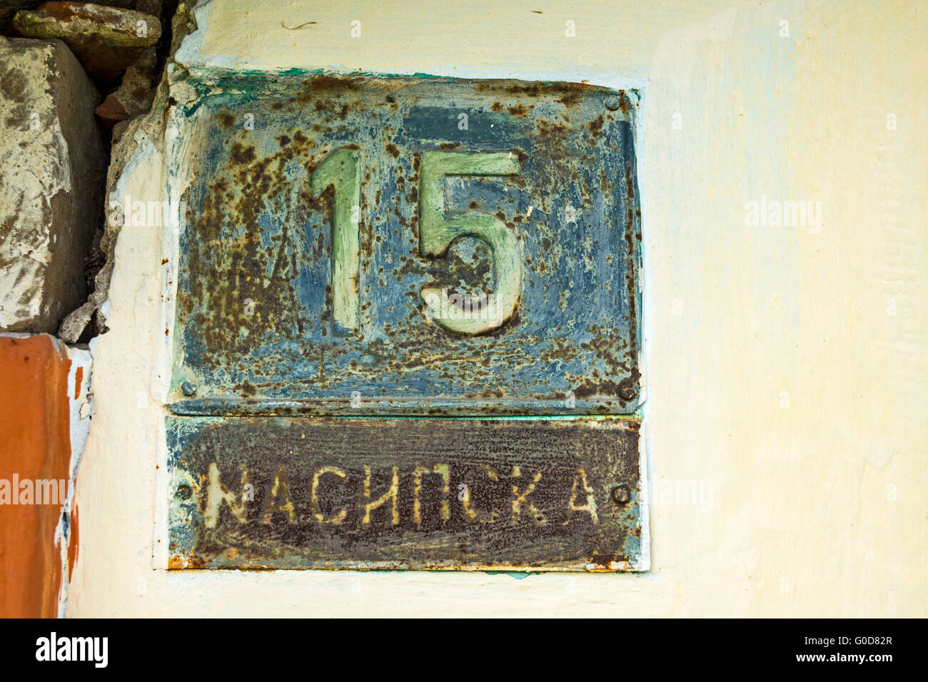 Old house with the number 15 and the name of the street. Stock Photo