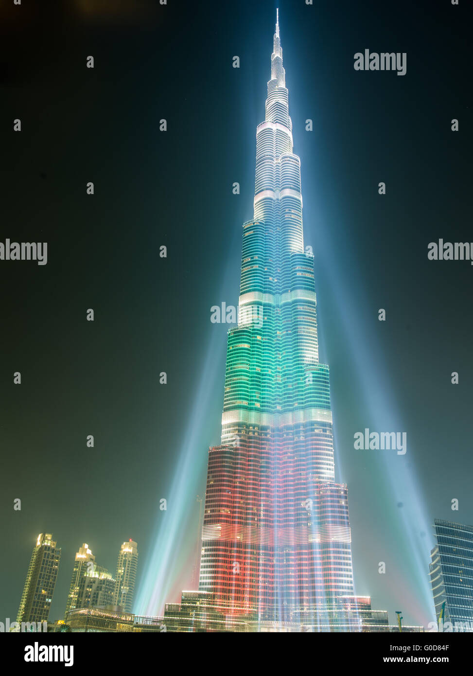 DEC 03 -DUBAI, UAE:  Burj Khalifa Tower floodlit in the white, green and red colours of the flag of the United Arab Emirates to  Stock Photo