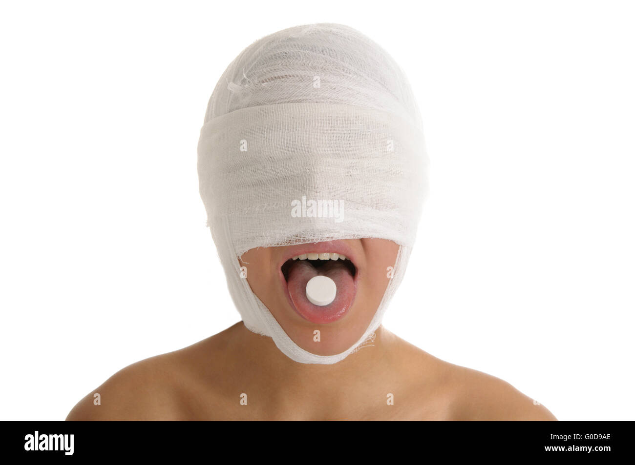 Woman with bandaged head with tablet in tongue Stock Photo