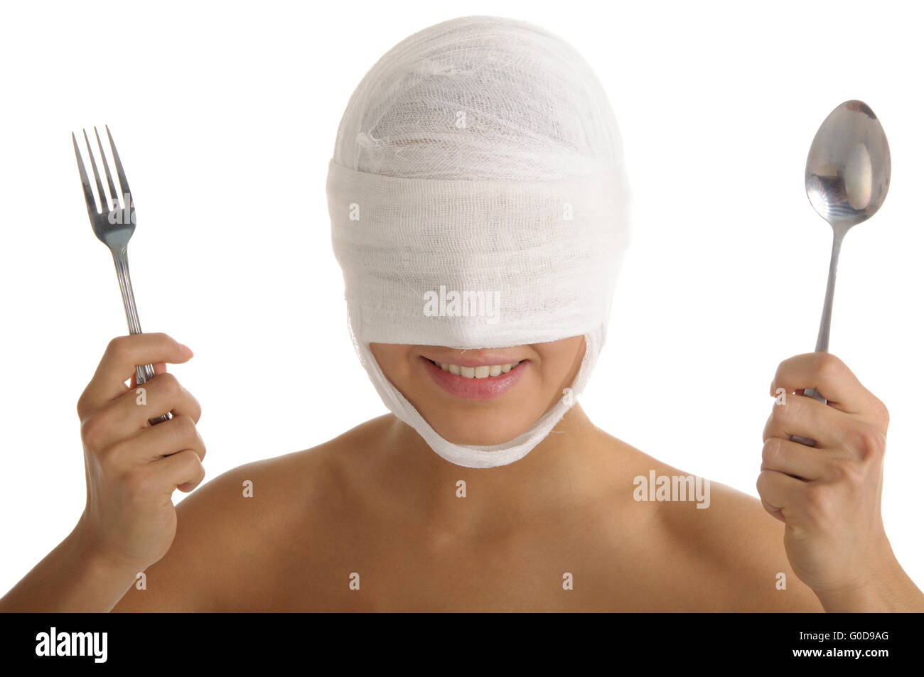 Young woman with bandaged head with plug and spoon Stock Photo