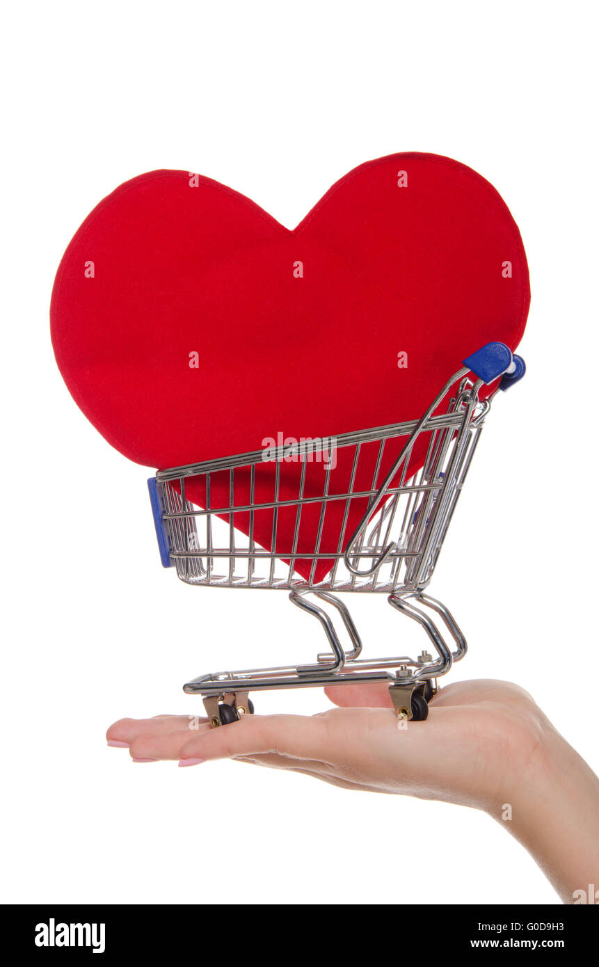 heart symbol in shopping trolley on the palm Stock Photo