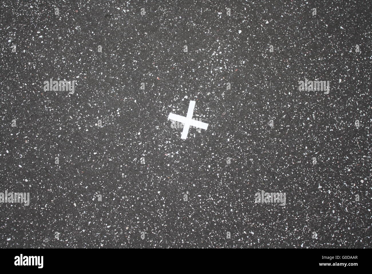 white cross on asphalt Stock Photo